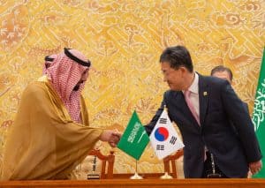 Saudi Crown Prince Mohammed bin Salman, left, shakes hands with South Korean President Moon Jae-In shakes hands during a meeting at the Presidential Blue House in Seoul on June 26, 2019. (AFP)
