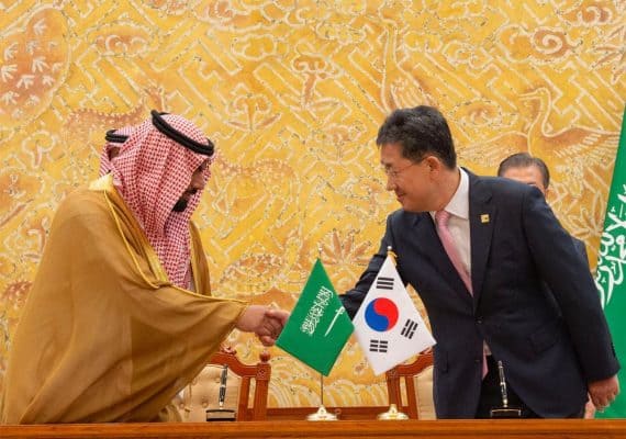 Saudi Crown Prince Mohammed bin Salman, left, shakes hands with South Korean President Moon Jae-In shakes hands during a meeting at the Presidential Blue House in Seoul on June 26, 2019. (AFP)