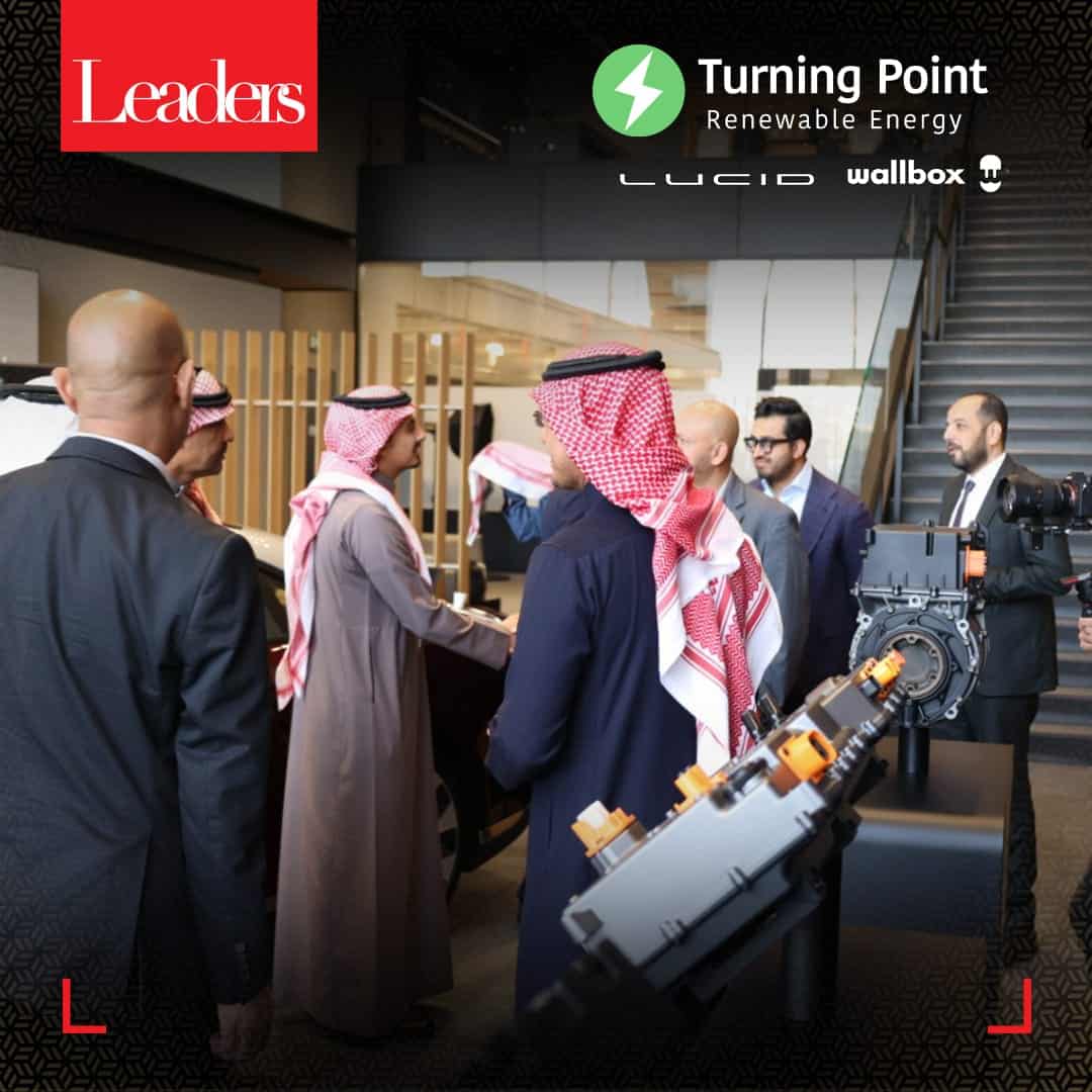 The officials of the two companies congratulate each other on the deal 